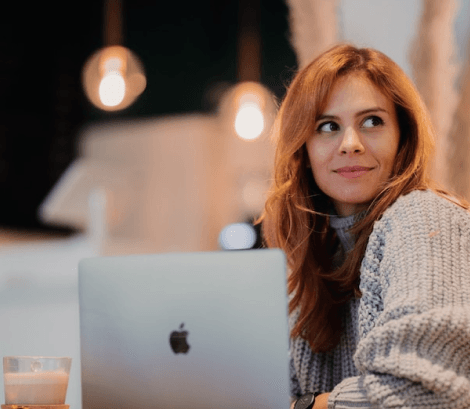 Woman working on a coffee shop